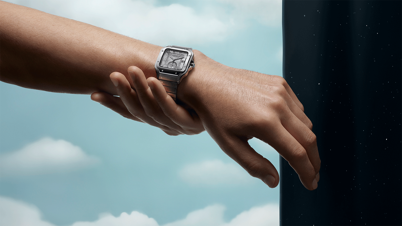 The new Santos Dual Time has a grey dial and comes with both a bracelet and a grey alligator strap.